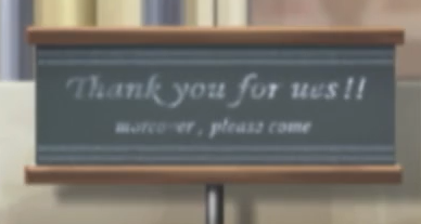 A sign with white text on a black background reading 'Thank you for ues!' with two exclamation marks. Smaller text below it reads 'moreover, please come'.